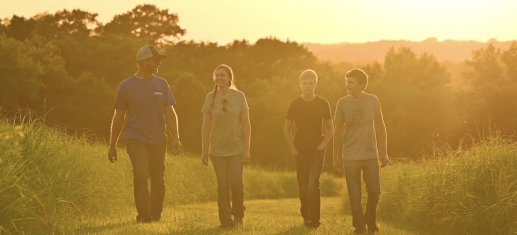 Chase Burns of LandGuys with his family in Western Illinois on their homestead property - Every Acre Tells a Story™